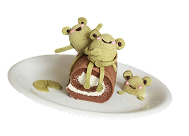 A swiss roll cake that looks like frogs on a log